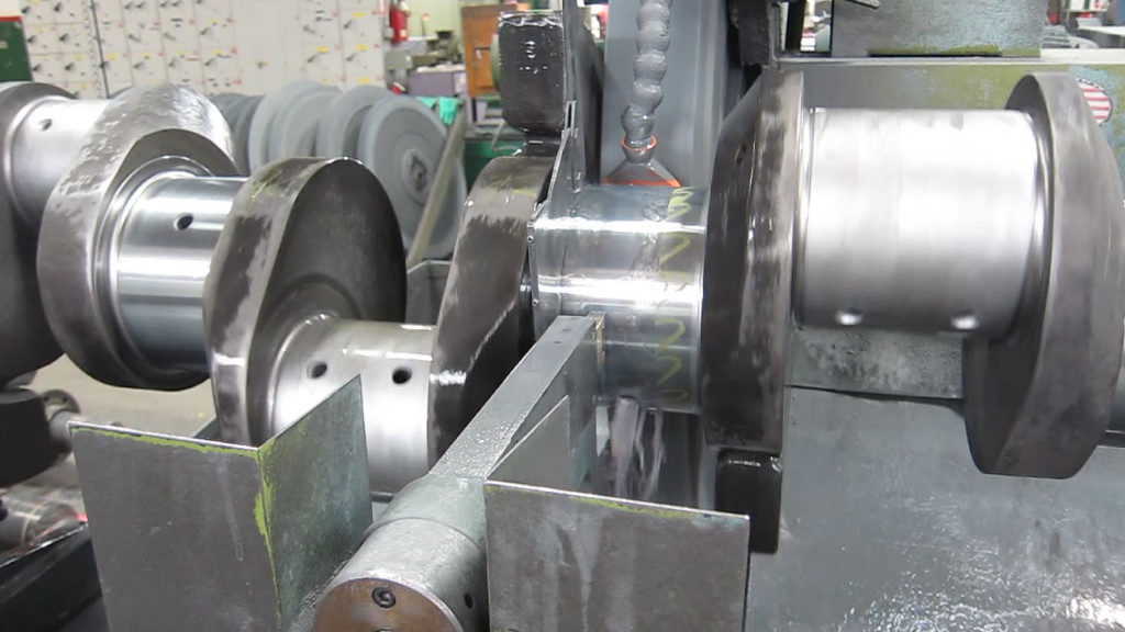 Closeup of crankshaft grinding of hard chrome plating